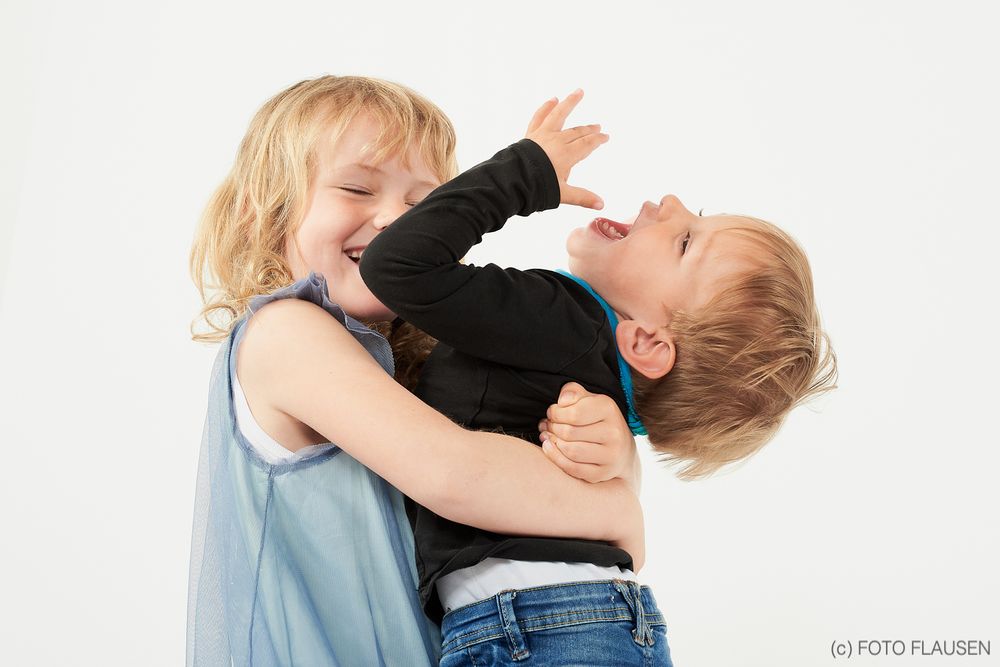 Picture with girl hugging her brother